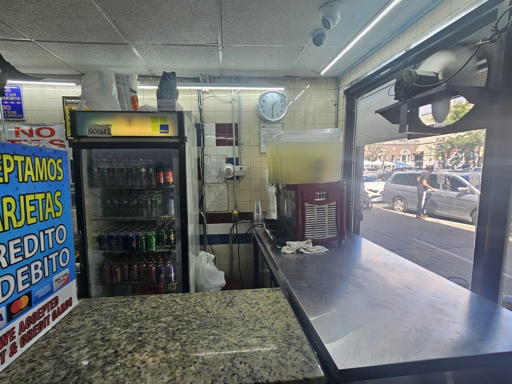 The small kitchen and counter define the fast, casual experience.