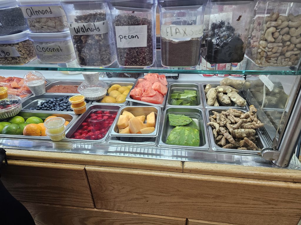 Fresh fruit and ingredients displayed inside DisFruta Juice Bar NYC