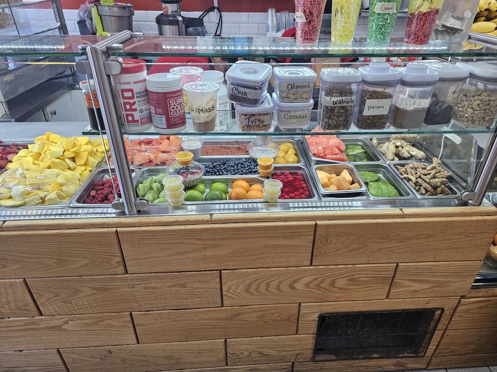 Fresh fruit display inside DisFruta Juice Bar NYC