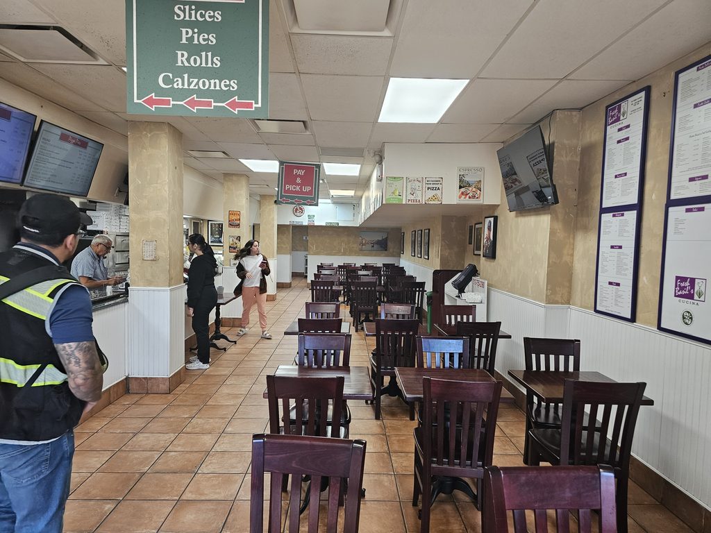  Interior dining area and service counter at Cassiano’s Pizza NYC