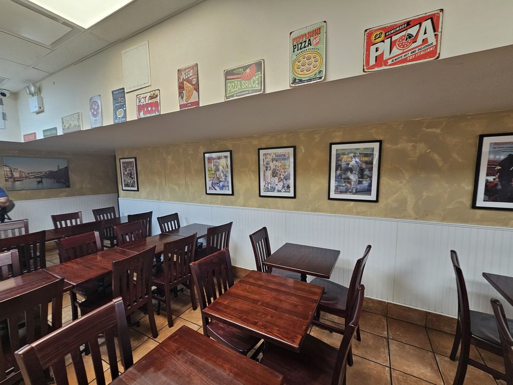 Spacious dining room seating inside Cassiano’s Pizza NYC