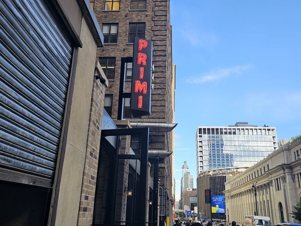  West 33rd Street and 9th Avenue street sign near Bar Primi Penn District