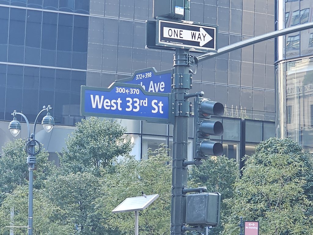  West 33rd Street and 9th Avenue street sign near Bar Primi Penn District