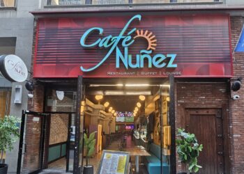 Café Nuñez NYC storefront at 240 W 35th St with red awning and restaurant sign
