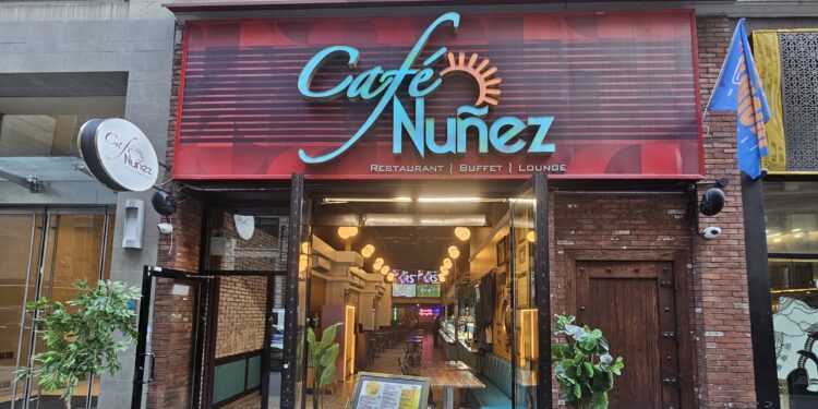 Café Nuñez NYC storefront at 240 W 35th St with red awning and restaurant sign