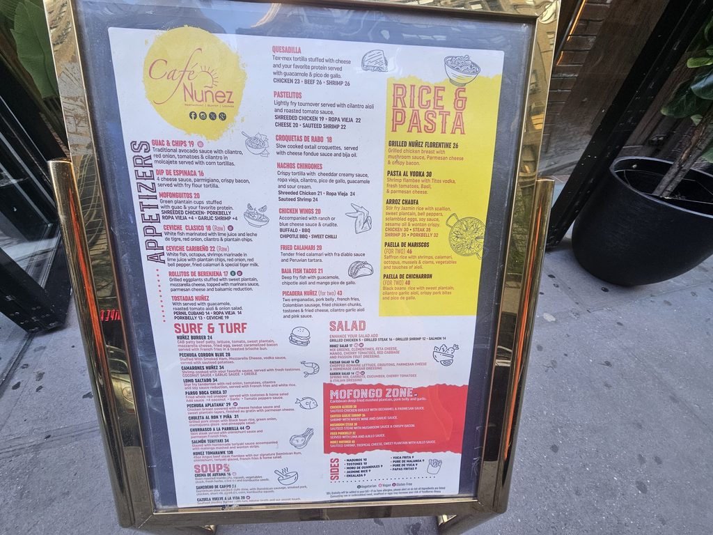 Café Nuñez NYC menu board showing Latin and Caribbean food selections