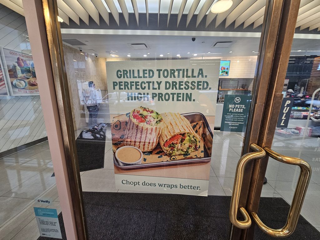 Grilled tortilla wrap poster in the window at Chopt Midtown Manhattan