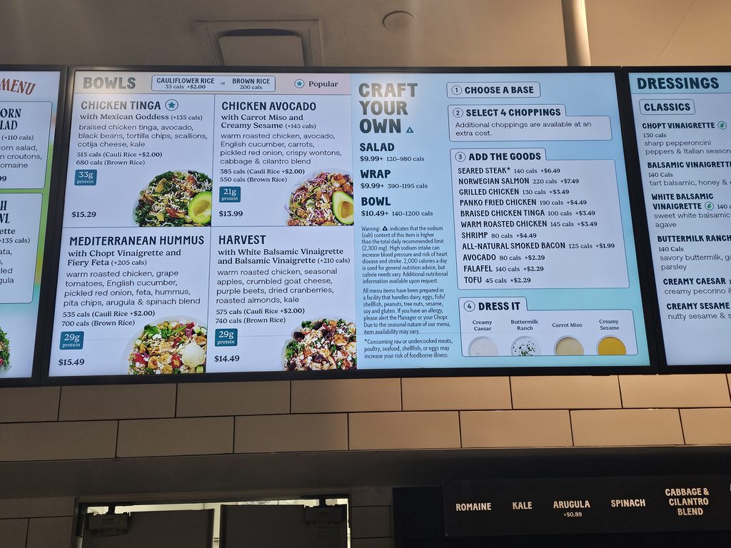 Signature bowls and Craft Your Own menu board at Chopt Midtown Manhattan